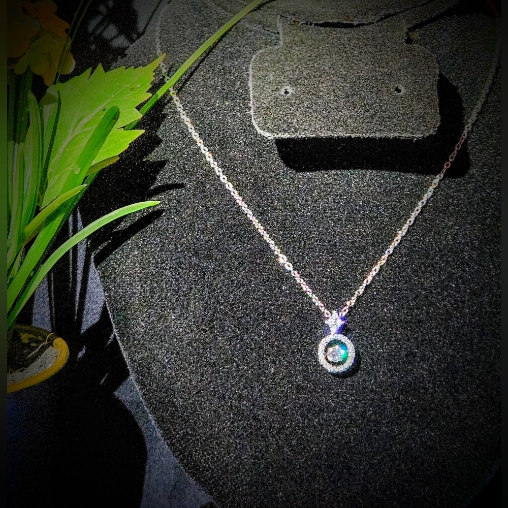 Moissanite And Silver "Dancing Stone" Pendant Necklace